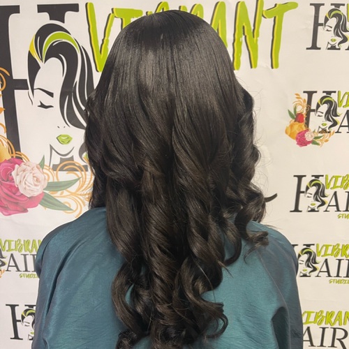 Silk press with clip-ins and curls