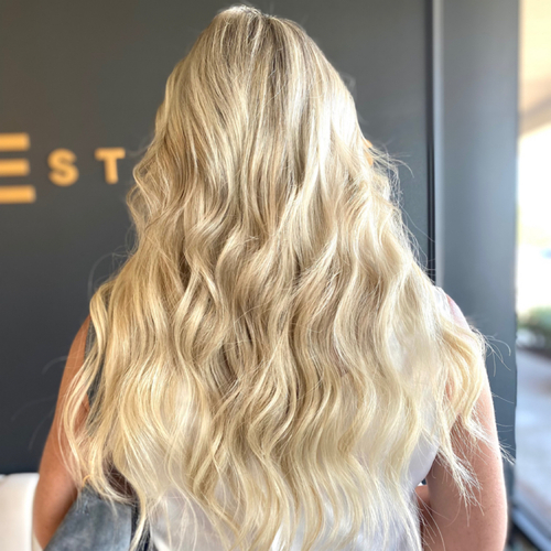 2 rows of volume weft extensions. I-tip extensions on sides with half head hilight. 