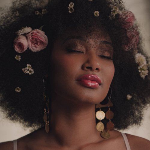 Soft glam full face makeup 
Floral placement 
Natural hair styling 
Editorial onsite HMUA
