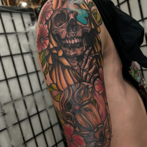 A Neo Traditional grim reaper and horse tattoo dedicated to his grandma. This design blends classic and modern elements, featuring a striking grim reaper riding a majestic horse, creating a powerful and heartfelt piece.