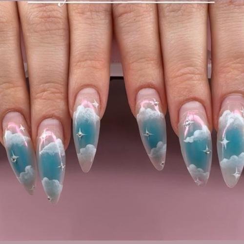 Almond acrylics with an airbrushed blue sky and clouds