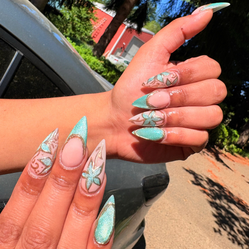 Almond acrylics with mint French tips and white floral line art