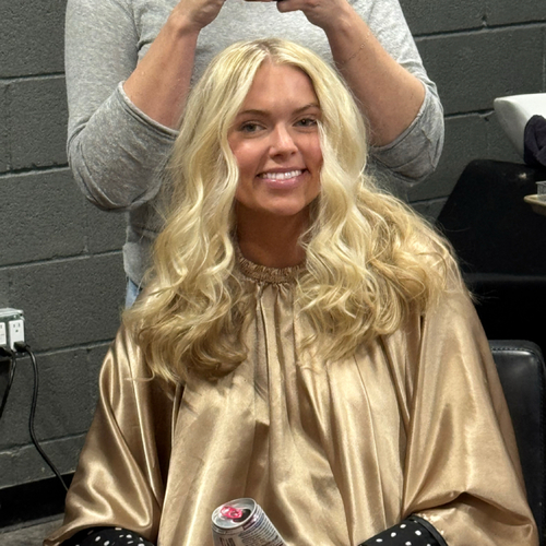 Signature blonde hair result with bright dimension and soft waves by Erica Wilson in Dallas