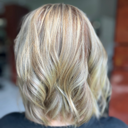 Gave this blah blonde some sunshine and happiness along with transforming this beauty we did some slight waves to give the illusion of thickness 