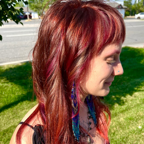All over color with Vivid color accents & haircut.
