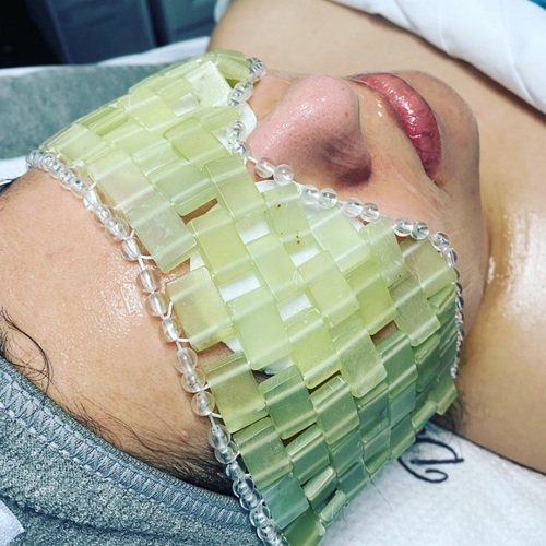 Jade eye mask to cool eyes, calm redness, and relieve tension and sinus pressure.