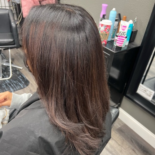 Full color over previous balayage. Trim and silk press.
