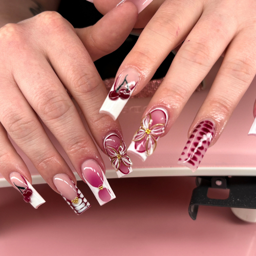Square acrylics with pink French tips, 3D flowers and checkered accents