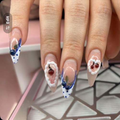 Almond acrylics with navy polka-dot French tips and 3D cherries