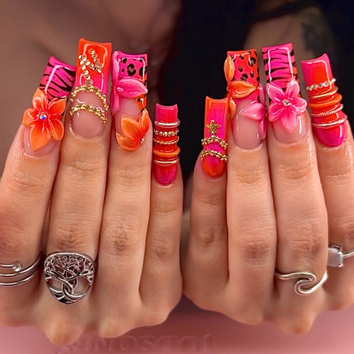 Extra-long square acrylics in hot pink and orange with 3D hibiscus flowers and gold chains