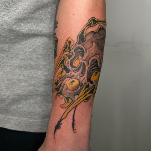 A Neo Traditional Japanese spider tattoo on the outer forearm, blending traditional Japanese elements with modern flair. This design features a striking spider with bold lines and vibrant colors, creating a captivating and dynamic piece! 
