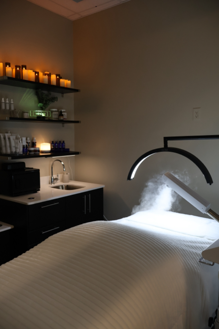 Clean, professional medical spa treatment room with neutral tones at Mended Esthetics in Providence