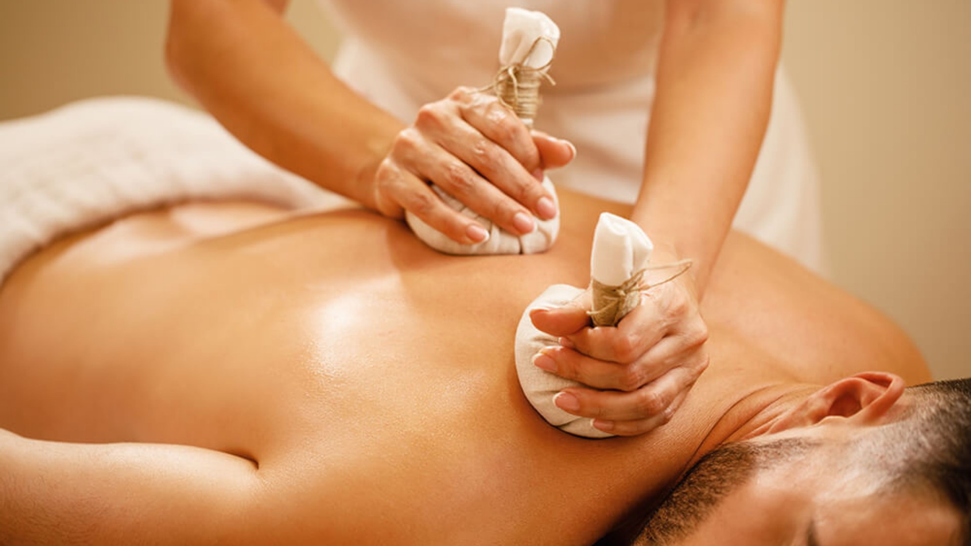 Clean, professional medical spa treatment room with neutral tones at Emerald Thai Holistic Massage in Laguna Beach