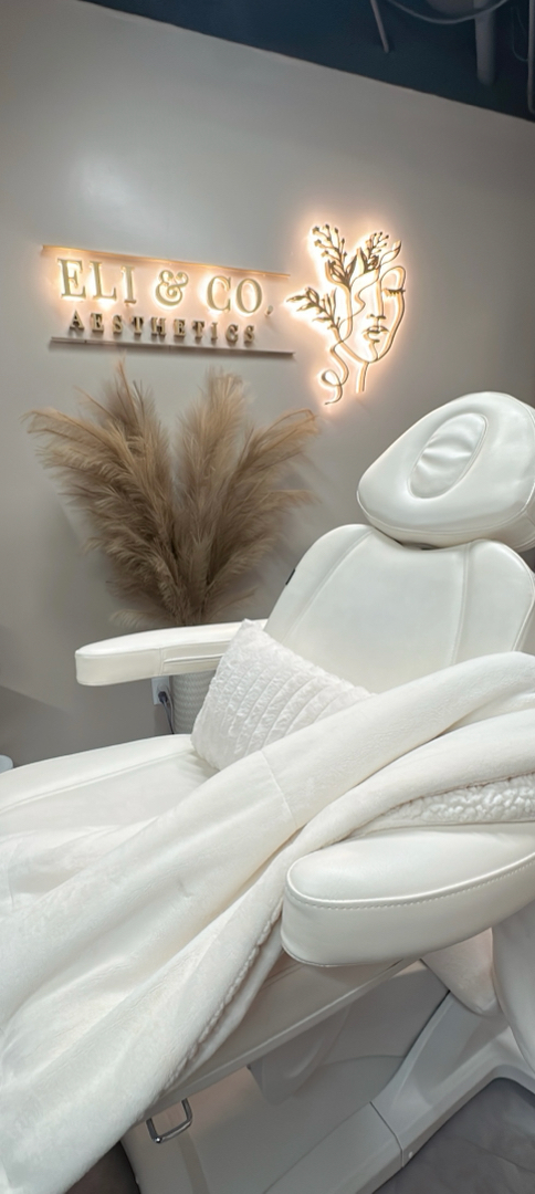 Clean, professional medical spa treatment room with neutral tones at Eli&Co. Aesthetics in Cherry Creek