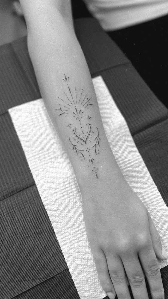 Large Fine Line Tattoo at TINY TATS in Naples, FL