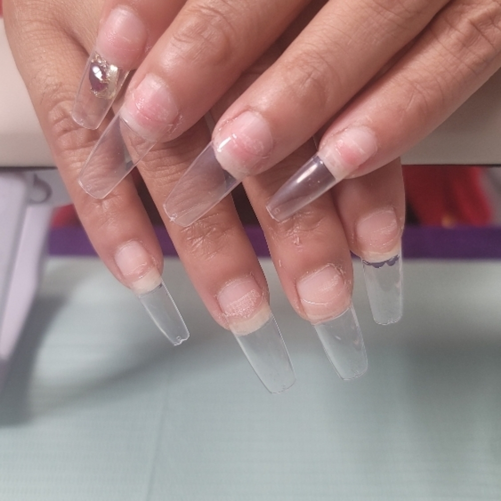 Adding nail tips at The Queen's Love in Farmers Branch, TX