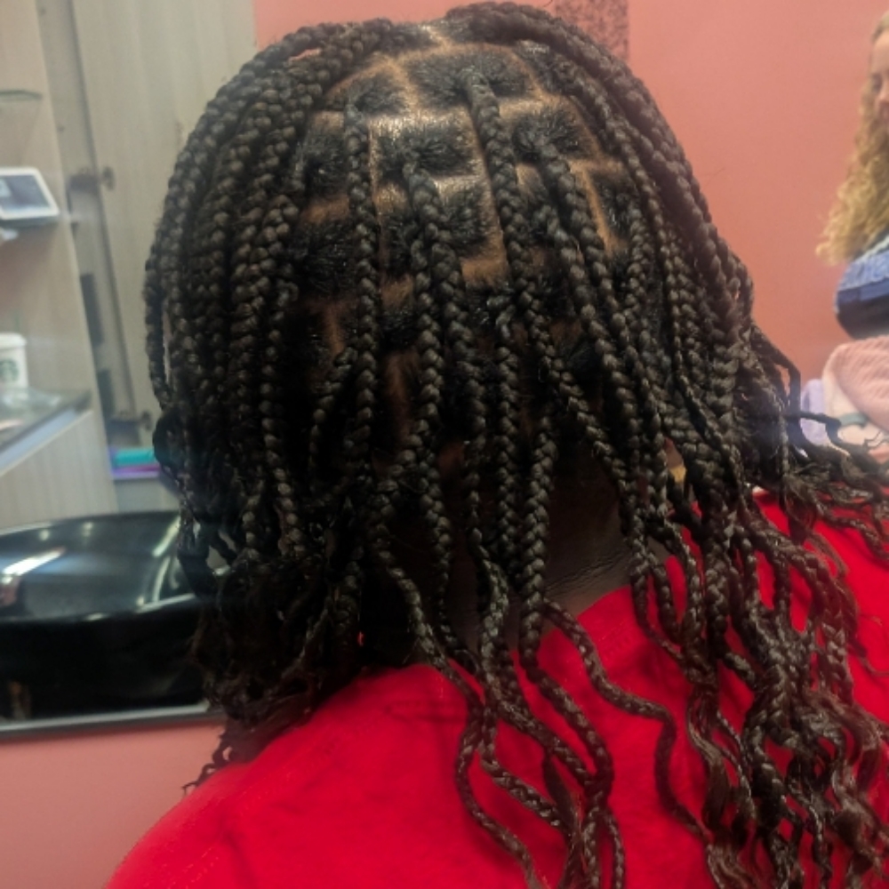 Kids traditional medium box braids at Smiles & Styles in Sioux City, IA