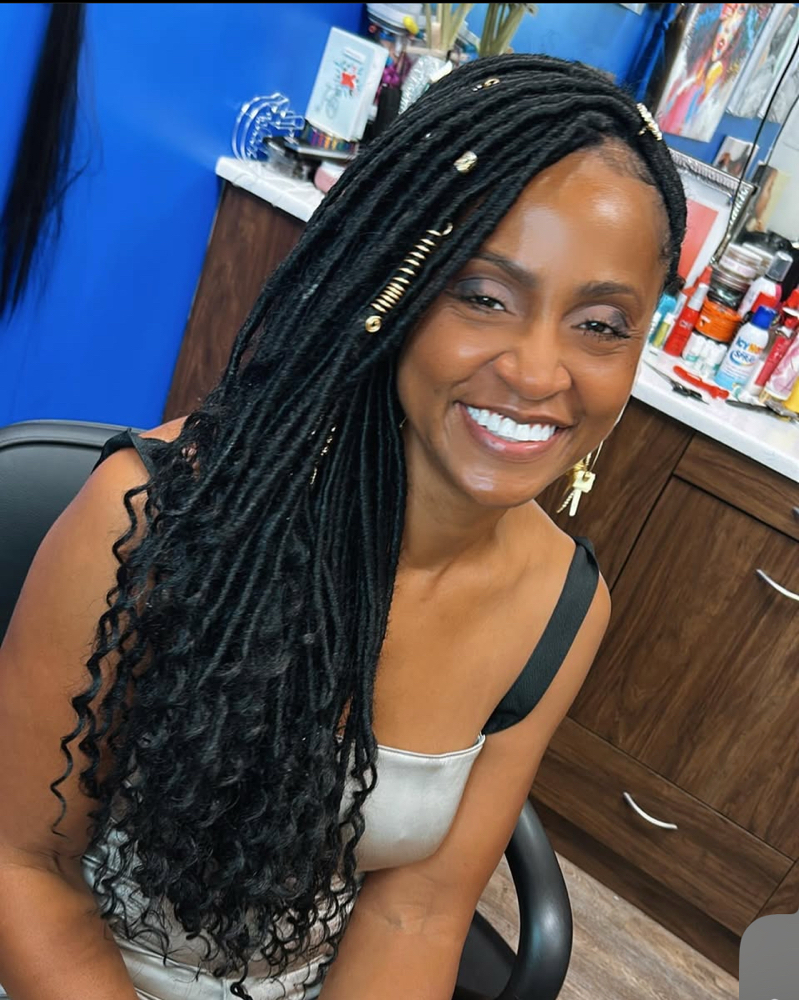 Faux Locs Mohawk at Boobabe Braidn Bar in Oxon Hill, MD