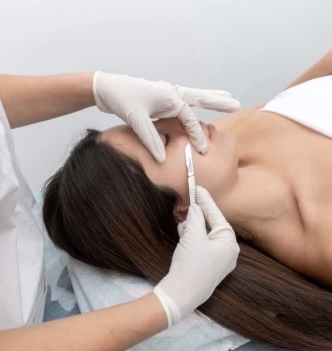 Dermaplane with Red Light Therapy