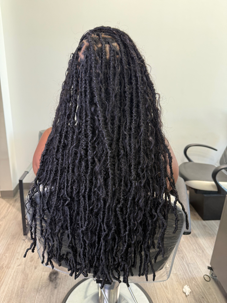 Soft Locs over locs at Manou Locs & Braids in Atlanta, GA