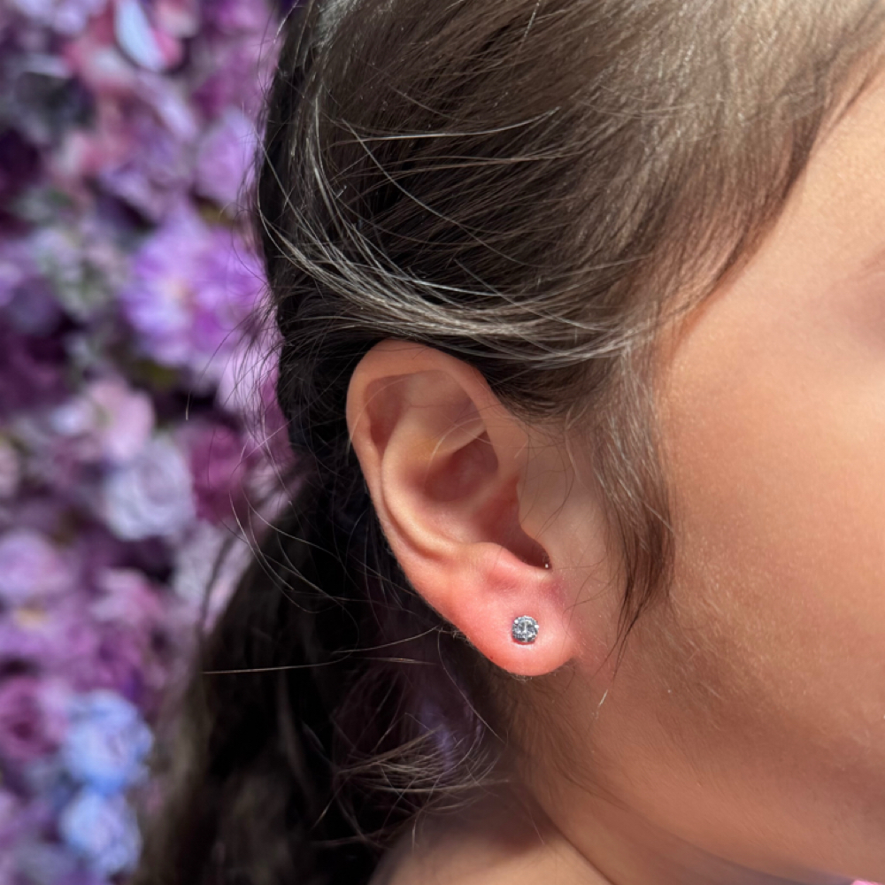 Kid’s Lobe Piercing at Dollface Ink & Piercing in Springdale, AR
