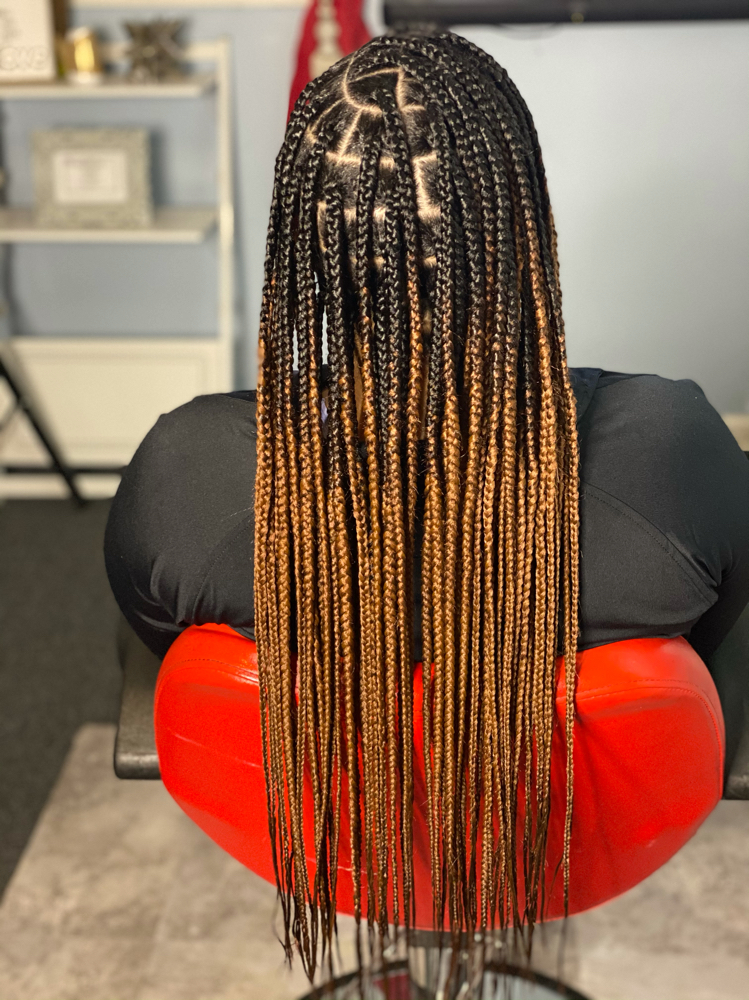 Large Waist length Knotless Braids at Crowned Hair in Augusta, GA