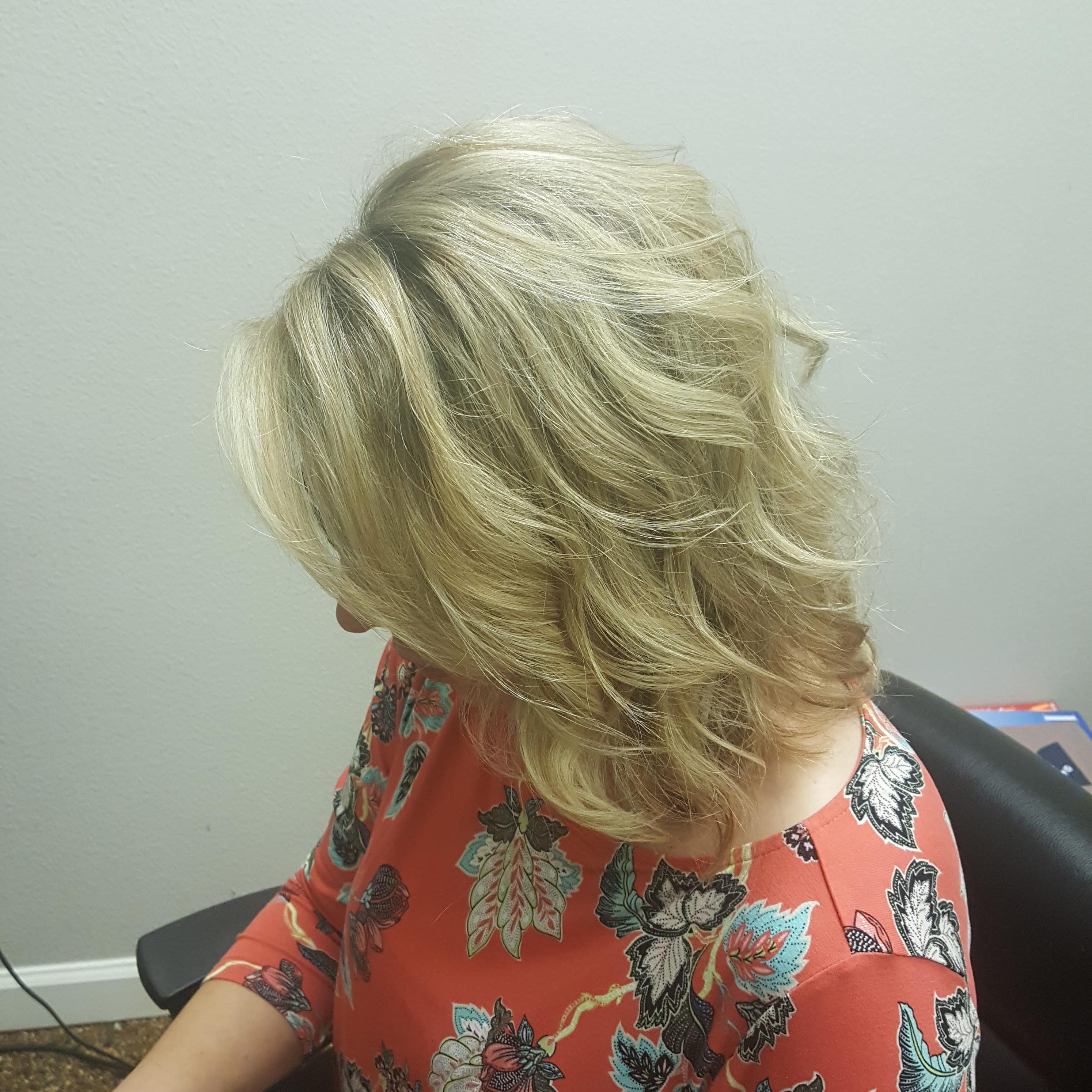 Cut at De Luxe Beauty Parlour in 93704