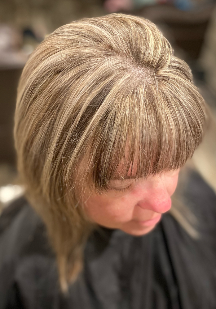 Women’s bang trim at Pretty Parlor By Lyric in Humble, TX
