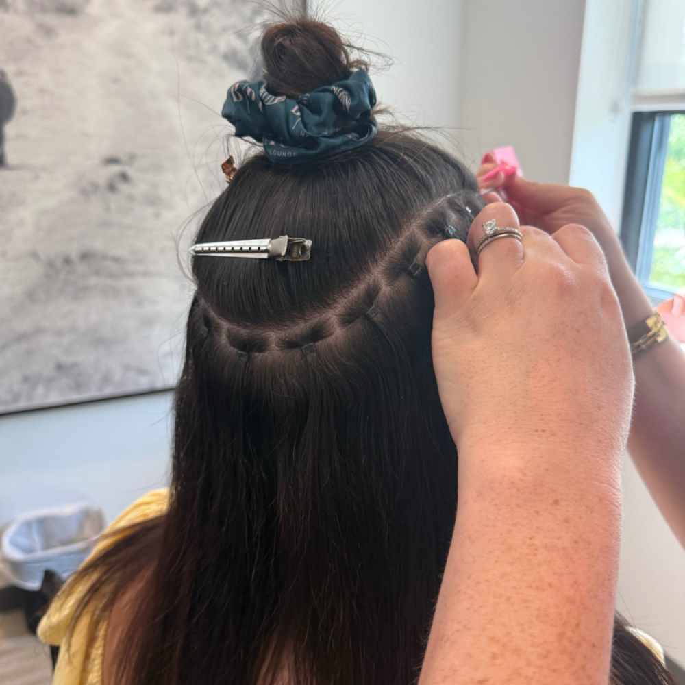 Hair extension installation at All About Me Beauty Bar in Labelle, FL