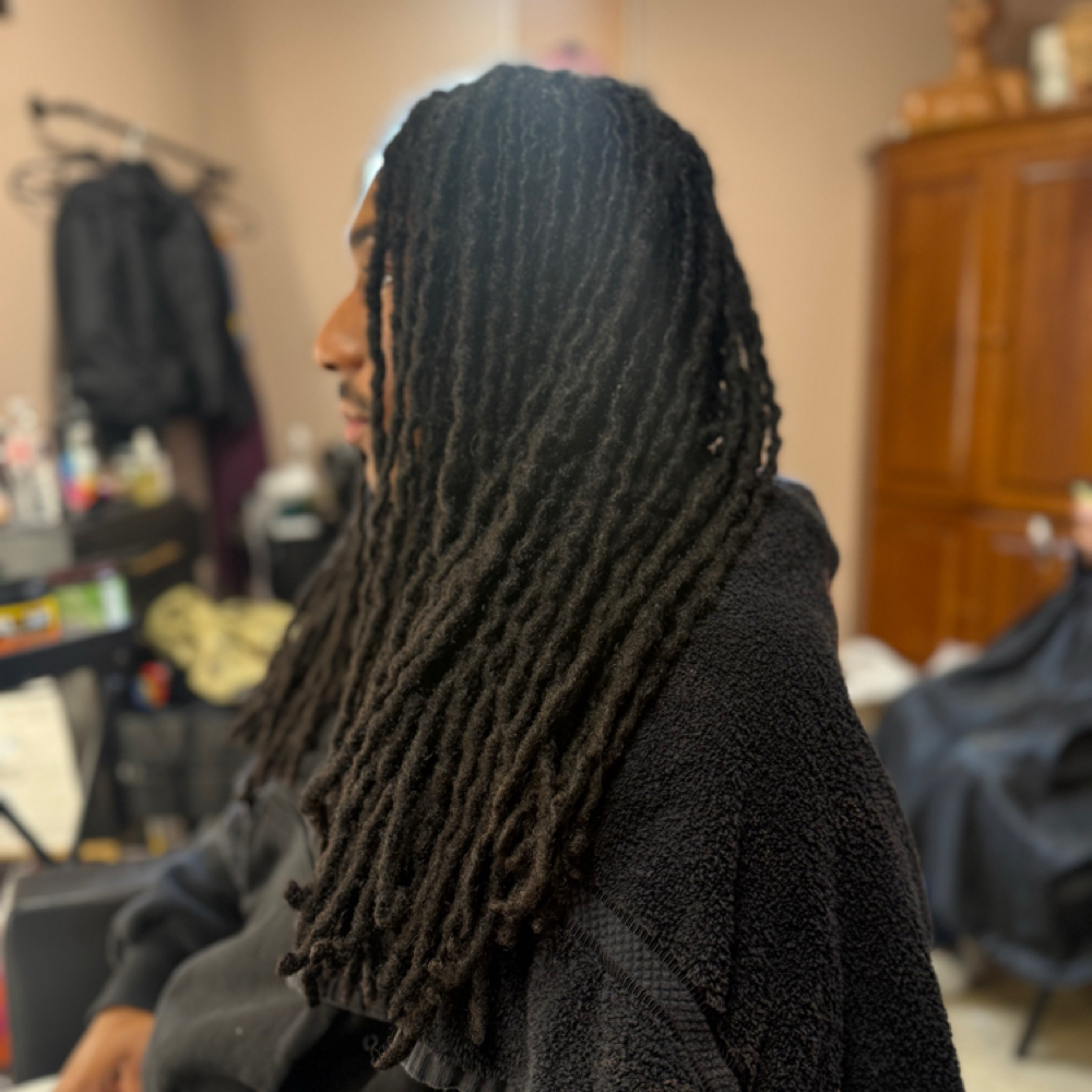 Loc Comb Out at XeNia Noir in Houston, TX