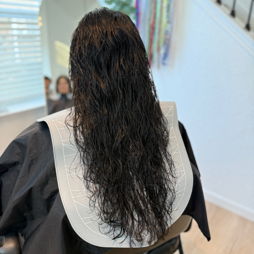 Long Curly Haircut & Natural Style at Merve Hyde Beauty in San Antonio, TX