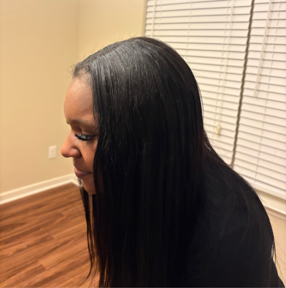 Quick weave at Touchedbyyasiii in Atlanta, GA