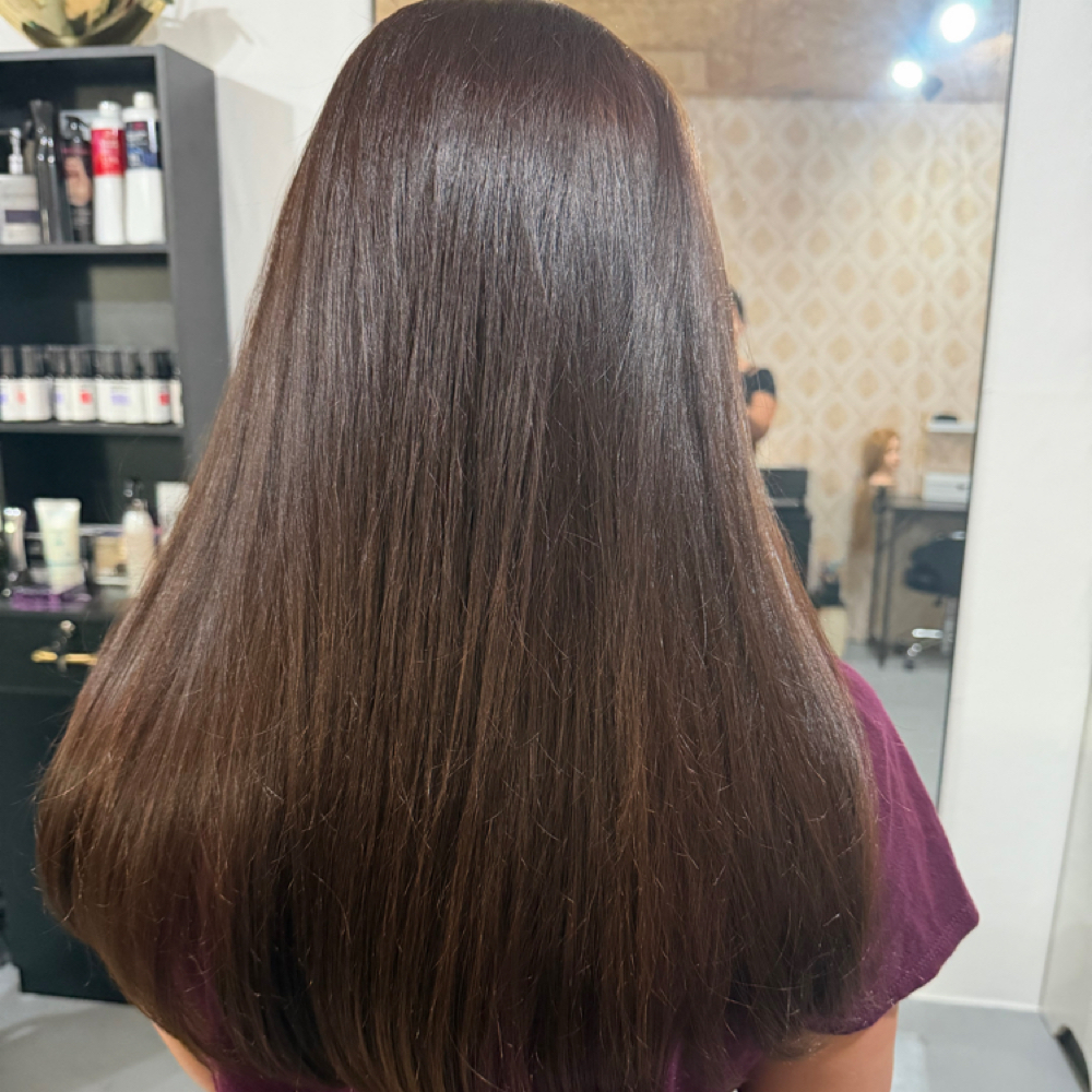 Gloss treatment at Triumph Beauty Salon in Houston, TX