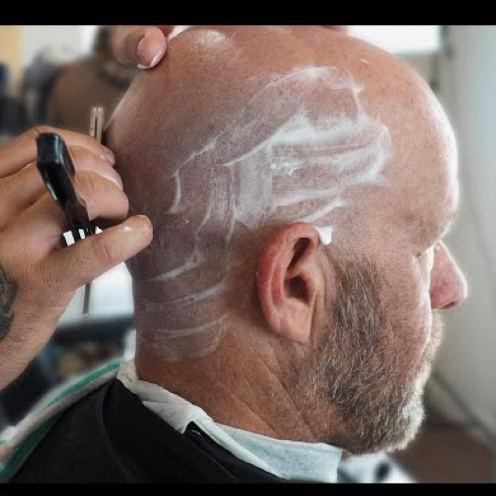 Bald Head With Razor at The Fade Factory Barbershop Chalfont in Chalfont, PA