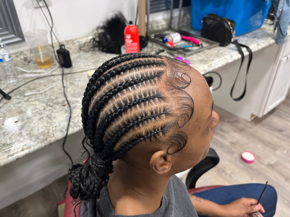10 stitch braids w/ 2 buns at The Hairapist Experience in Mount morris, MI