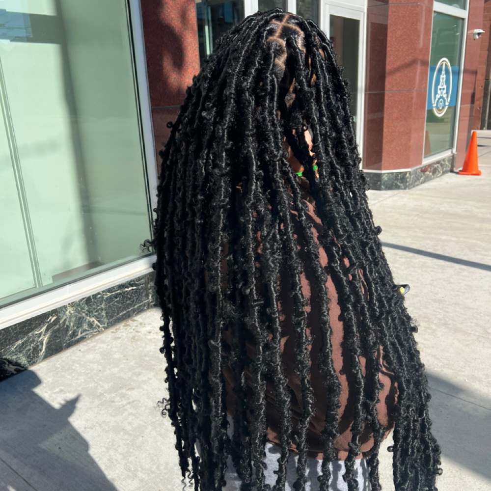 butterfly locs butt length at braidsbyderri in atlanta, GA