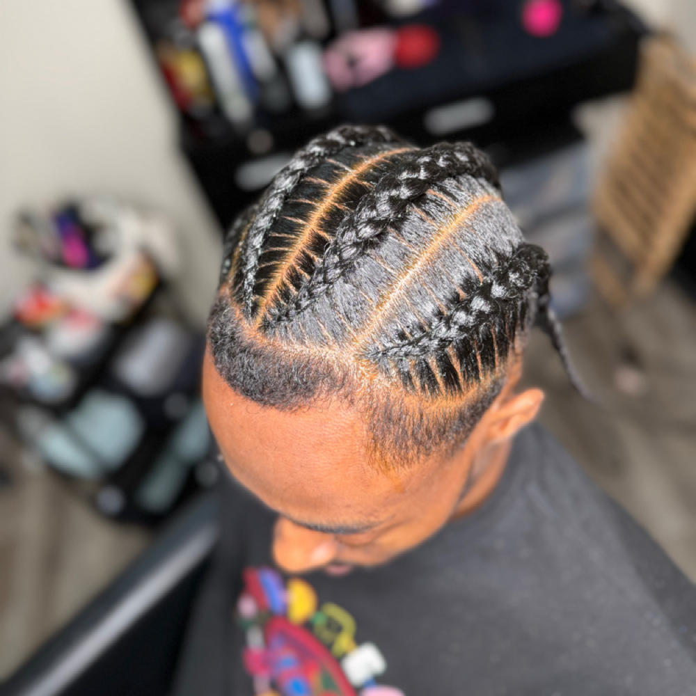 Men / Boys Four Stitch Braids at Faith TheBraider in Milwaukee, WI