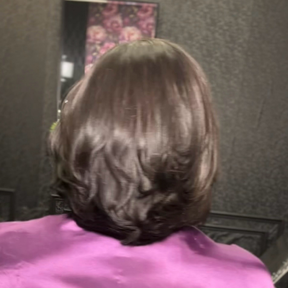 Silk Press w/ Smoothing Treatment at The Royale Touch Hairtique in Houston, TX