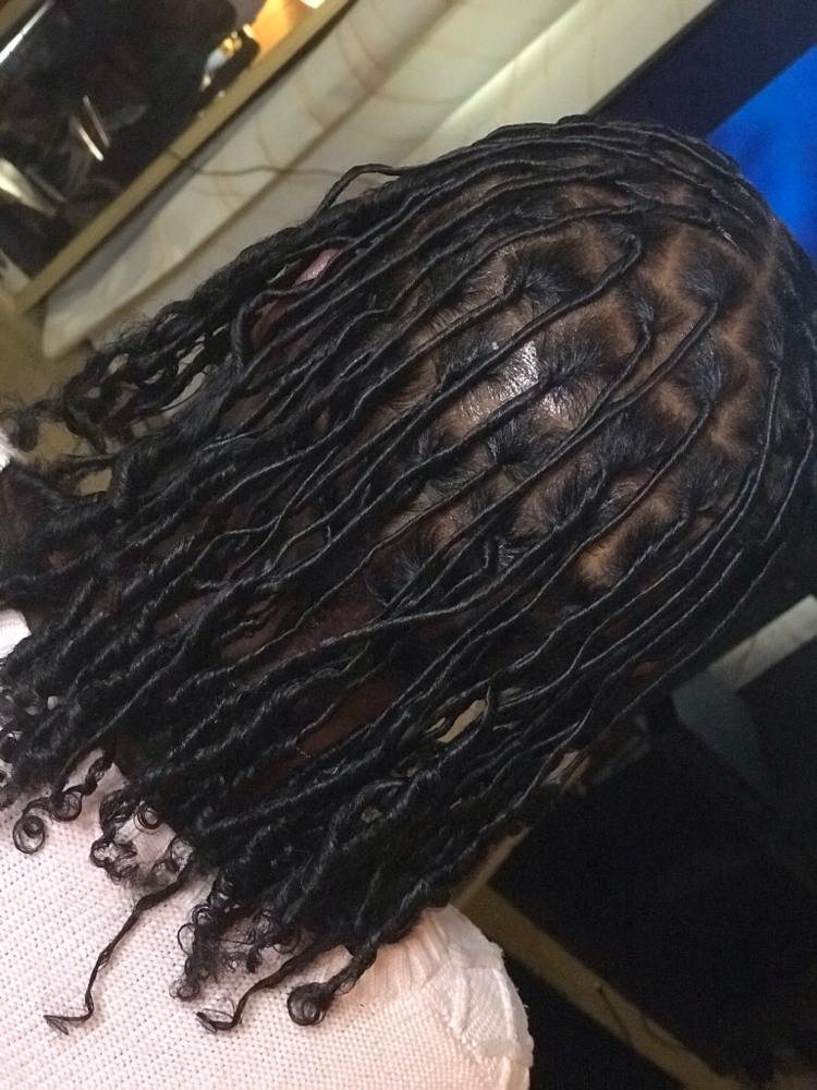 Starter Locs On Long Hair at HouseOfARAS Smith in Taft, OK