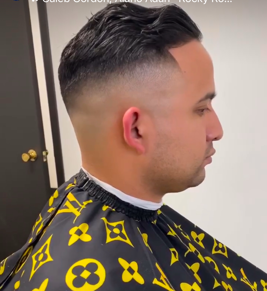 Male Hair Cut With A Barber