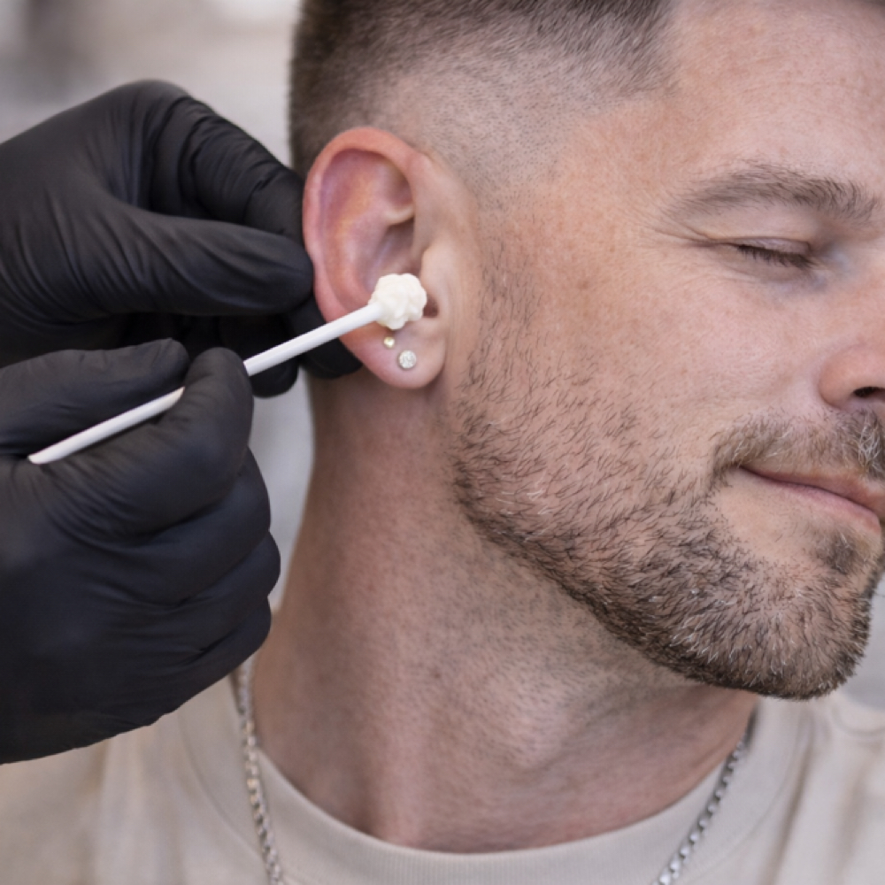 Ear Wax at Fades and Flow by Nicole LLC in Mount Pleasant, WI