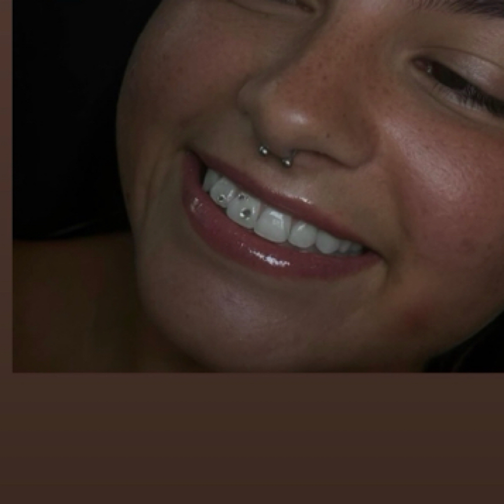 One Tooth Gem at JT Beauty Studio in Bloomington, IN