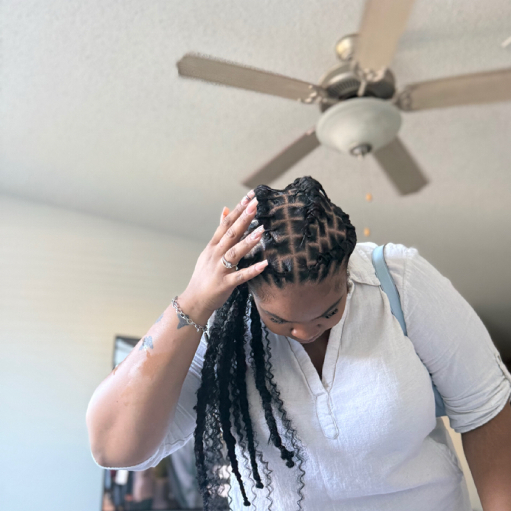 Loc Style With Weave at braidedbyniya in fayetteville, NC