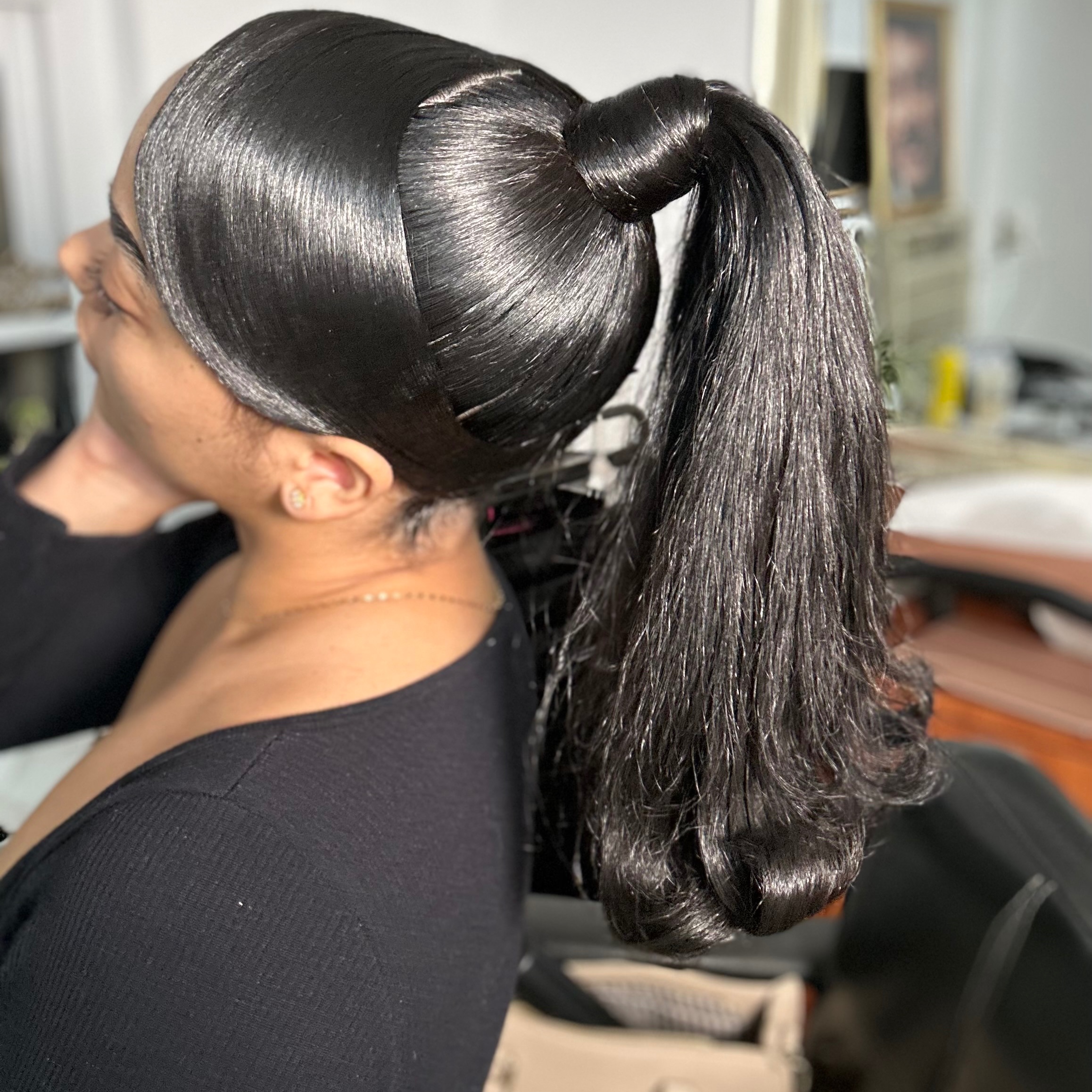 Side Swoop Barbie Ponytail at EBNY Hair Studio in Mount Vernon, NY