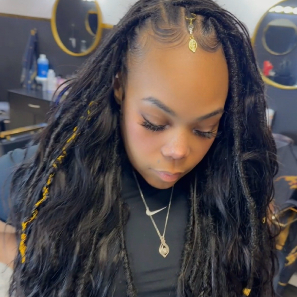 Mermaid locs at Artistry by Loc God in Memphis, TN