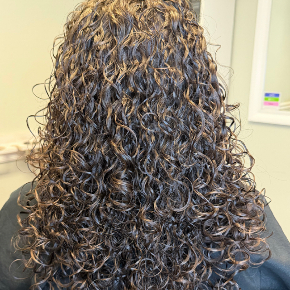 Rëzo Curly Haircut at Hair & Nails By Serena in Eugene, OR