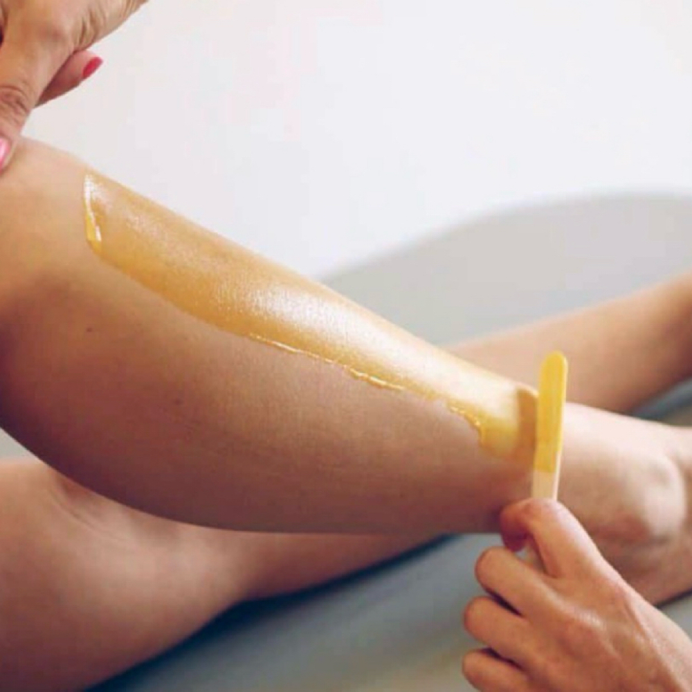 Body Waxing: Half Leg at Nyah Simone Spa in Garden City, NY