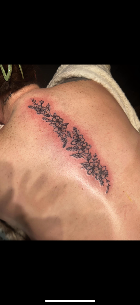 HALF SPINE TATTOO