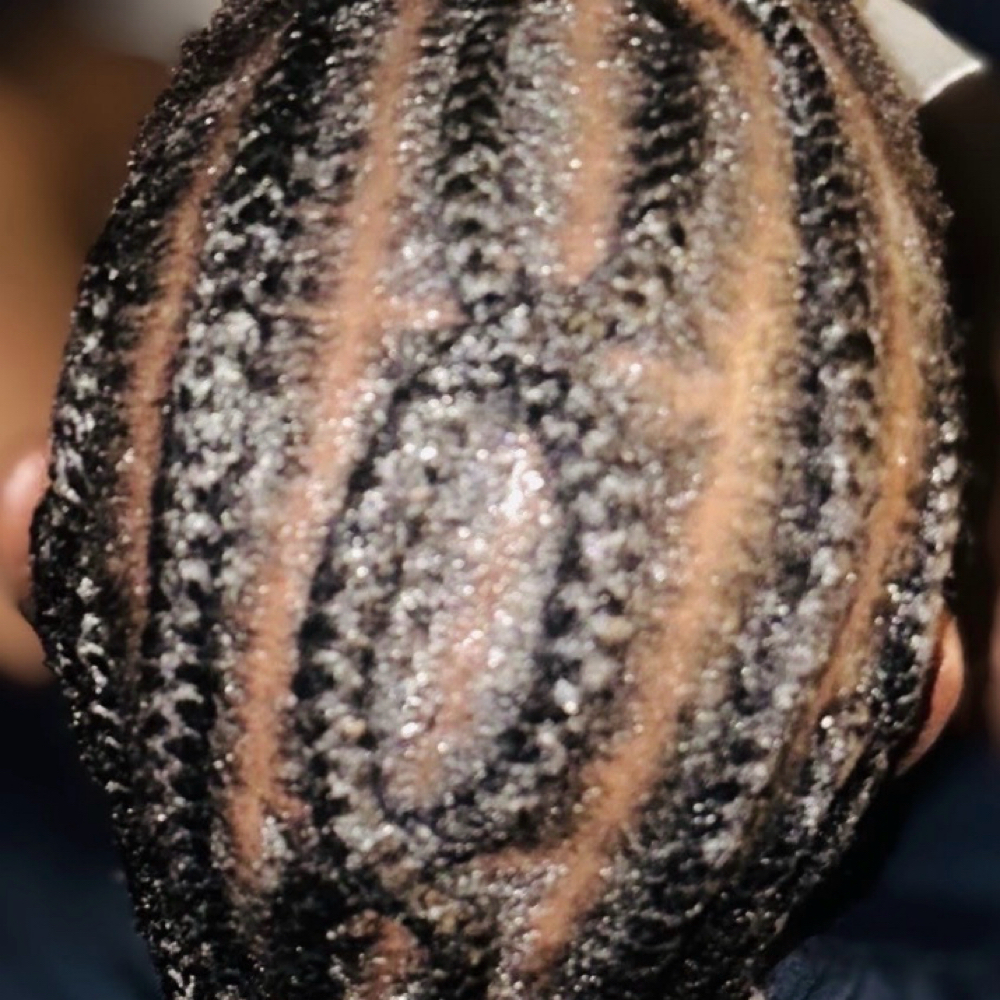 Cornrows at Crowned By Braids in Tonawanda, NY