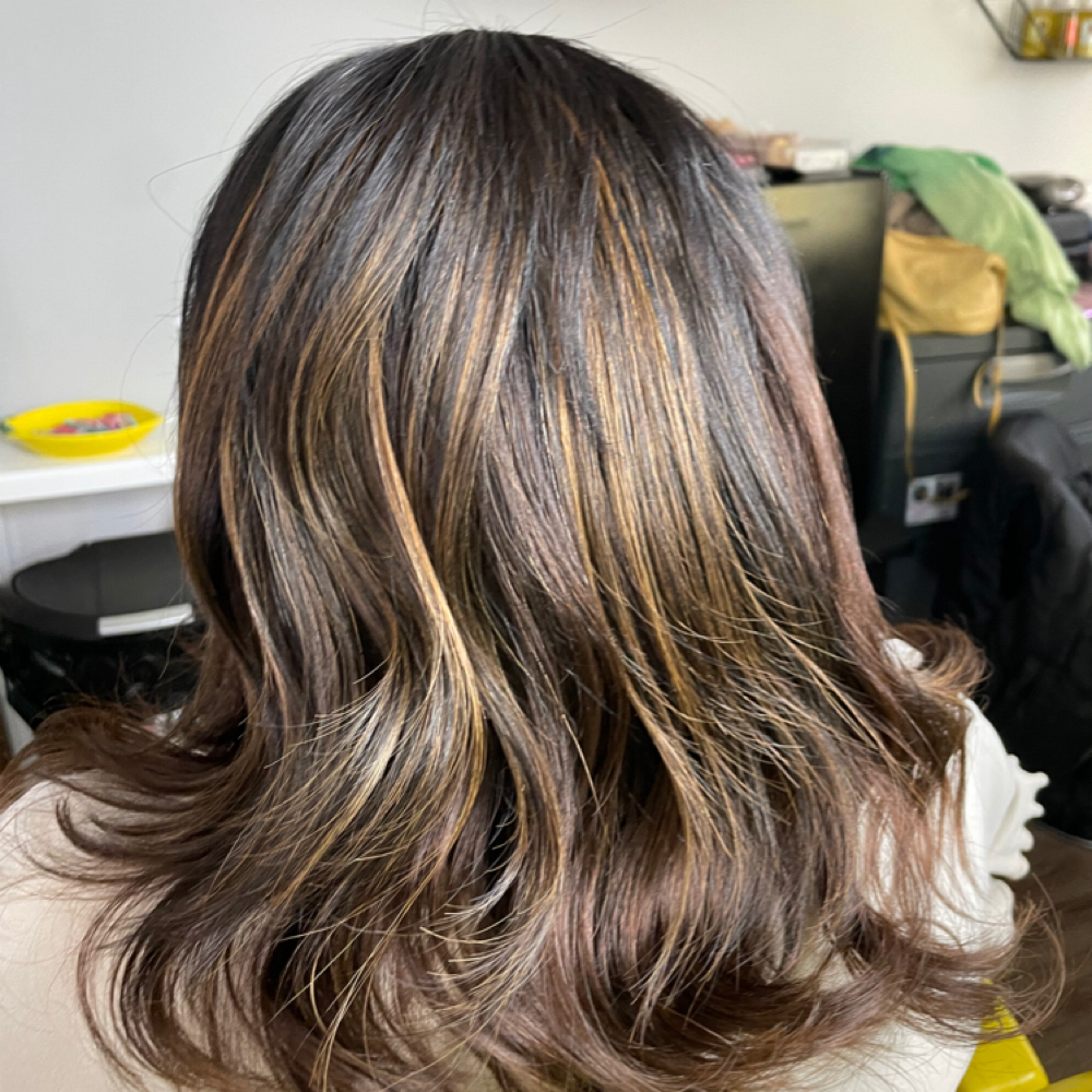 Full Sew-in at Queen Of The Crown in Charlotte, NC
